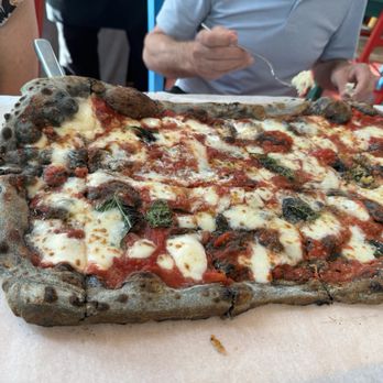 'O Munaciello - This is the large pizza with charcoal dough/ crust - Pizza Near Me - Miami, Florida