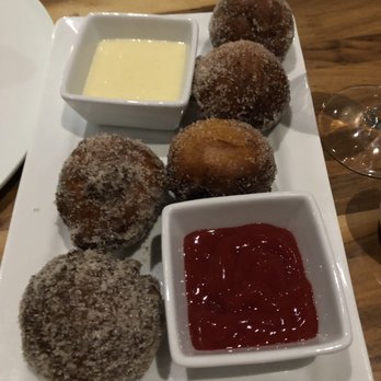 Branca Midtown - Zeppole (Italian fried dough) with raspberry and icing dipping sauces. - Pizza Near Me - Rochester, New York Branca Midtown - Zeppole (Italian fried dough) with raspberry and icing dipping sauces. - Pizza Near Me - Rochester, New York