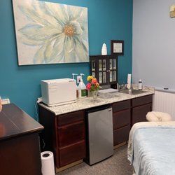 Bodywork By Barbara - Treatment room with hot towel cabinet and fridge for cold bottled water