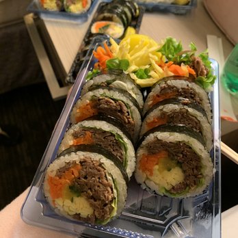Gimbap Shop - a person holding a tray of sushi - Korean Near Me - North York, Ontario Gimbap Shop - a person holding a tray of sushi - Korean Near Me - North York, Ontario