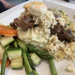 Strip Steak with Crab and Shrimp over Mashed Potatoes Strip Steak with Crab and Shrimp over Mashed Potatoes