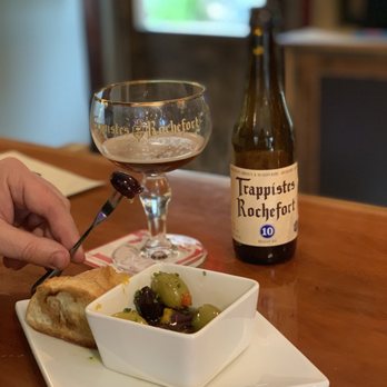 Woods Bay Wine - a glass of wine and a plate of food - Wine Bars Near Me - Bigfork, Montana