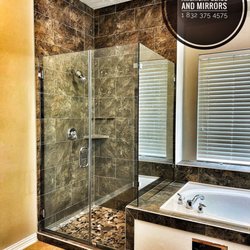 American Glass - Frameless Master Glass Enclosure with a 28" wide door, Inline Notch panel and return panel, all to a height of 80" from the top of the curb