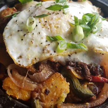 Topgolf - Beef brisket and potato hash with sunny side egg(they cooked it medium) - Golf Near Me - Roseville, California Topgolf - Beef brisket and potato hash with sunny side egg(they cooked it medium) - Golf Near Me - Roseville, California