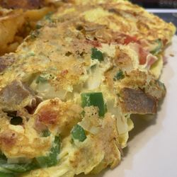 Red Hook Diner - Mexican Omelet $12.99 Chili, Peppers, Onions, Tomatoes & Cheddar Cheese, w/ Salsa & Sour Cream on the side