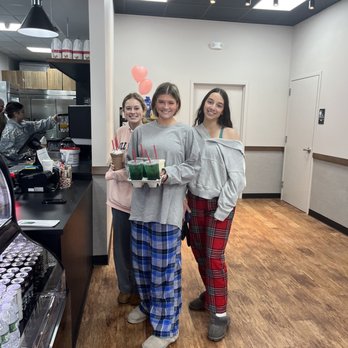 Aroma Joes - Middleton - three girls in pajamas holding a cake - Coffee & Tea Near Me - Middleton, Massachusetts Aroma Joes - Middleton - three girls in pajamas holding a cake - Coffee & Tea Near Me - Middleton, Massachusetts
