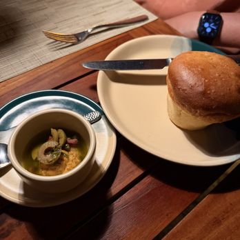 El Farallón - Their house made focaccia with olives on a hummus- was nothing like focaccia and not even a good roll - Seafood Near Me - Cabo San Lucas, BCS