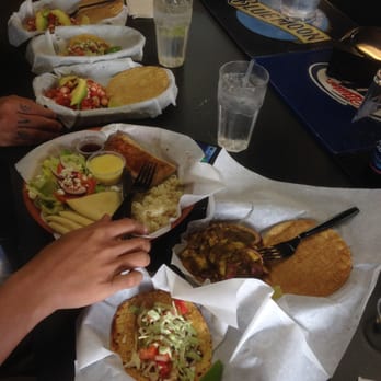 Off The Hook Fish Grill - All these hungry hands in my photo LOL. Mahi Mahi plate, shrimp/fish tacos/ agauchile in the front. - Seafood Near Me - Whittier, California Off The Hook Fish Grill - All these hungry hands in my photo LOL. Mahi Mahi plate, shrimp/fish tacos/ agauchile in the front. - Seafood Near Me - Whittier, California