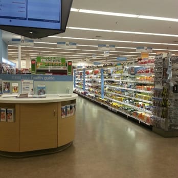 Walgreens - a grocery store with a television in the background - Drugstores Near Me - Apache Junction, Arizona