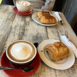 Metissage - Pain au chocolat with cappuccino (front) and hot chocolate (back).