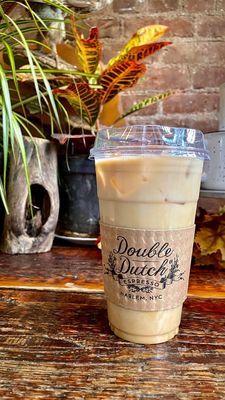 Photo of Double Dutch Espresso - New York, NY, US. Vanilla iced coffee on store front counter