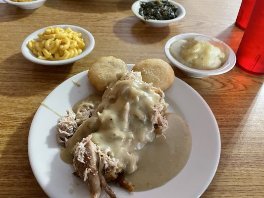 Photo of Jeff's Family Friendly Restaurant - Murfreesboro, TN, US. Chicken and dressing, Mac and Cheese, Mashed Potatoes, Turnip Greens, Hot water cornbread