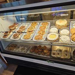 A selection of pecan tarts, quiche, bagel dogs, and other goodies.