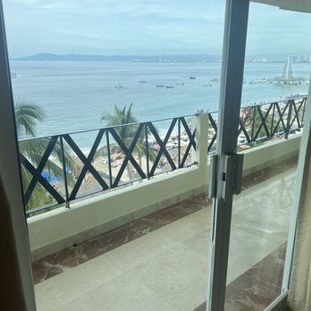 Blue Chairs Resort - Terrace directly facing ocean and Blue Chair Bar below. - Hotels Near Me - Puerto Vallarta, JAL Blue Chairs Resort - Terrace directly facing ocean and Blue Chair Bar below. - Hotels Near Me - Puerto Vallarta, JAL