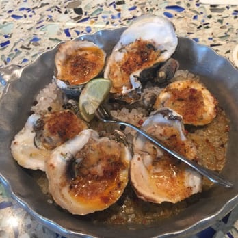 Caracol - Wood grilled oysters in chipotle butter. - Seafood Near Me - Houston, Texas Caracol - Wood grilled oysters in chipotle butter. - Seafood Near Me - Houston, Texas