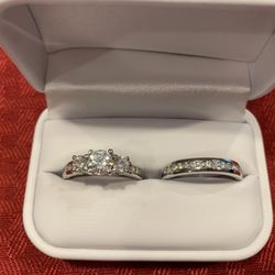 Simon Jewelers - 3-stone diamond ring set in platinum with matching wedding band.