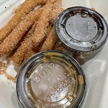 Chef's Custom Cuisine - Funnel cake fries covered in cinnamon sugar with caramel and chocolate sauce for dipping. - Food Trucks Near Me - Pagosa Springs, Colorado