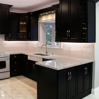 Vish And Brother - a kitchen with black cabinets - General Contractors Near Me - Schenectady, New York Vish And Brother - a kitchen with black cabinets - General Contractors Near Me - Schenectady, New York