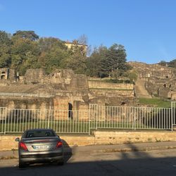Théâtres Romains de Fourvière - Looking at Lugdunum ruins from the street going towards the Basilica