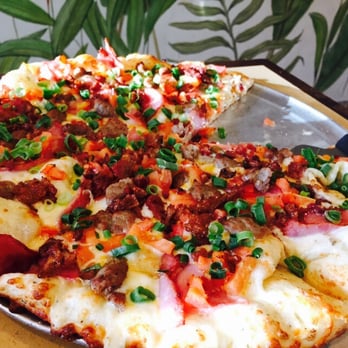 Round Table Pizza - The monster that is the Hearty Bacon Supreme. The large was $29 -- expensive, but great quality! - Pizza Near Me - Honolulu, Hawaii