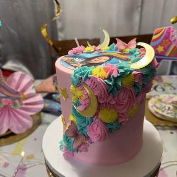 Sweet Oven Bliss - Pink buttercream w/ pipping design and purple butterflies & teal, yellow & pink frosting. Edible image & gold moon & star - Bakeries Near Me Sweet Oven Bliss - Pink buttercream w/ pipping design and purple butterflies & teal, yellow & pink frosting. Edible image & gold moon & star - Bakeries Near Me