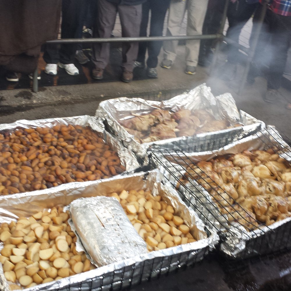 Dinner...cooked for hours over wood and stones buried in the ground.