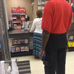 Winn-Dixie Stores - The women was checking her lotto ticket, after 15min the manager came to help. Took another 15 min to help the gentleman behind.
