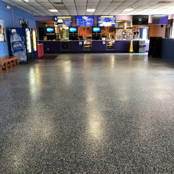 Showland Cinema - Our recently beautifully remodeled lobby area with epoxied floors and Sparkling White Quartz countertops. - Cinema Near Me - Plymouth, Indiana Showland Cinema - Our recently beautifully remodeled lobby area with epoxied floors and Sparkling White Quartz countertops. - Cinema Near Me - Plymouth, Indiana