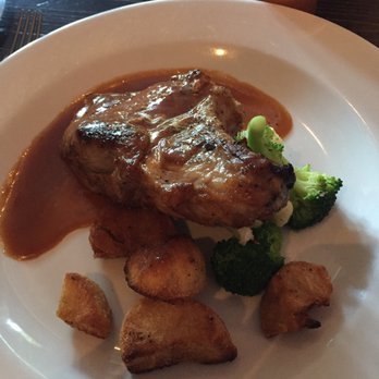 La Cosecha Bar + Restaurant - My dinner pork chop and potatoes with veggies. - Spanish Near Me - Paso Robles, California