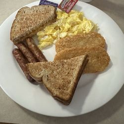 Kelly's Restaurant - Scrambled eggs, sausage, links, deep-fried, hashbrowns, and wheat toast with some jam.