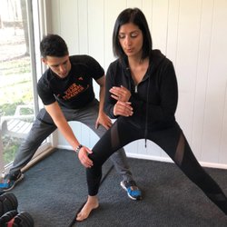 Your Personal Trainer - Wyatt and Seema doing side lunges