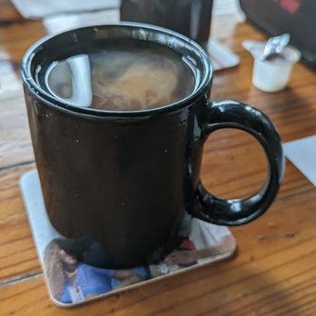 Sunset Grille - a cup of coffee on a coaster - American Near Me - Saint Petersburg, Florida Sunset Grille - a cup of coffee on a coaster - American Near Me - Saint Petersburg, Florida