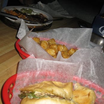 Zane's Tavern - Philly and tater tots with tiny plate of carne asada in the background - American Near Me - Snowmass Village, Colorado Zane's Tavern - Philly and tater tots with tiny plate of carne asada in the background - American Near Me - Snowmass Village, Colorado