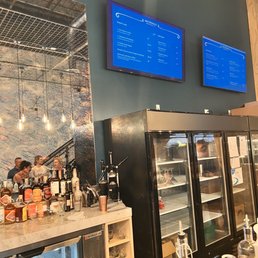 a bar with drinks and menus