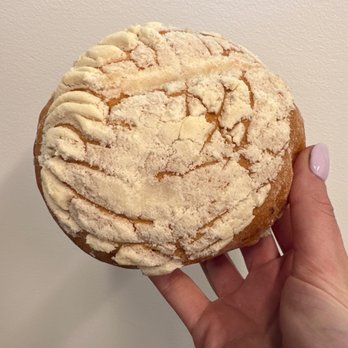 Panaderia Luna - a hand holding a pastry - Bakeries Near Me - Aurora, Colorado Panaderia Luna - a hand holding a pastry - Bakeries Near Me - Aurora, Colorado