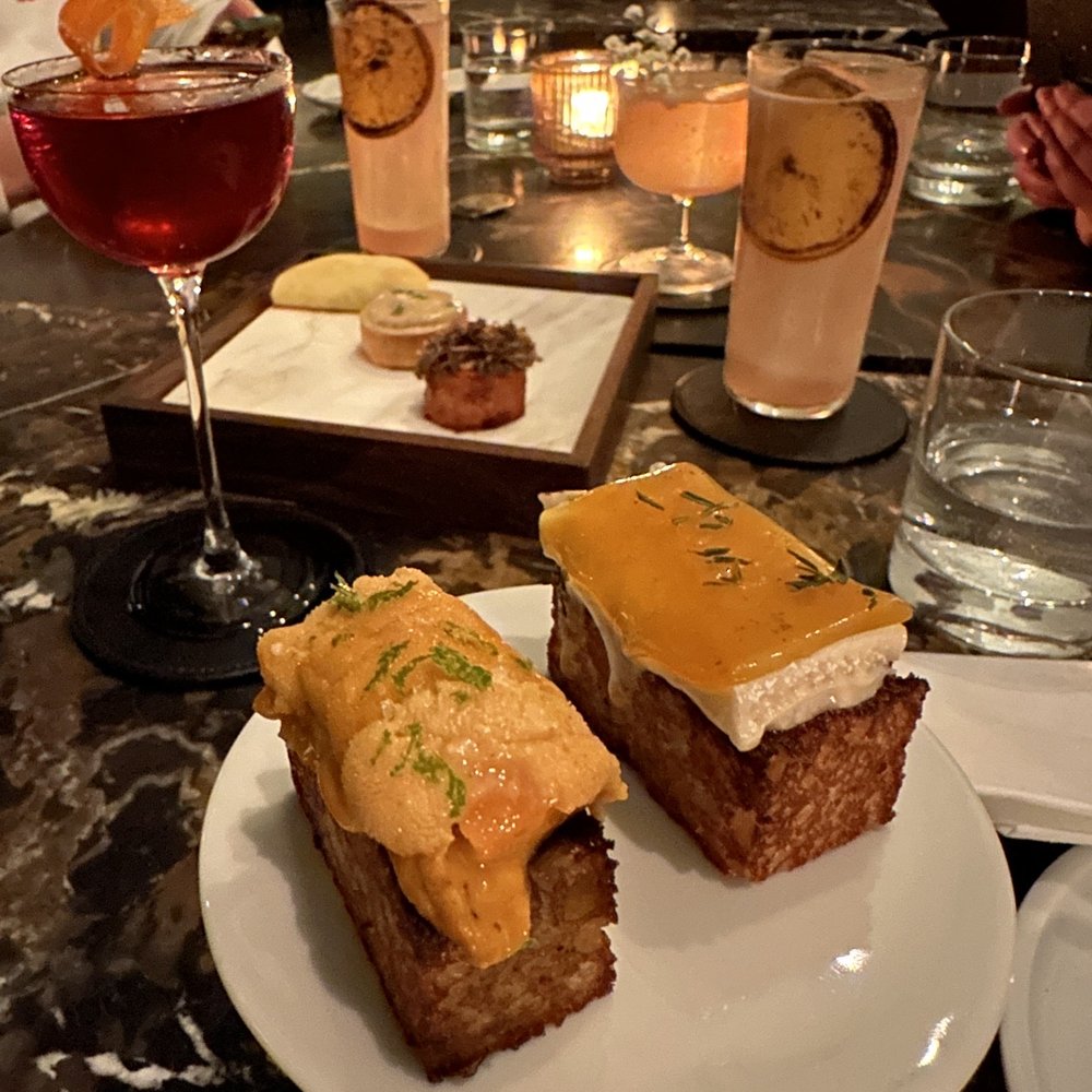 Bar Banane - a plate of sandwiches and a glass of wine - Cocktail Bars Near Me - Toronto, Ontario