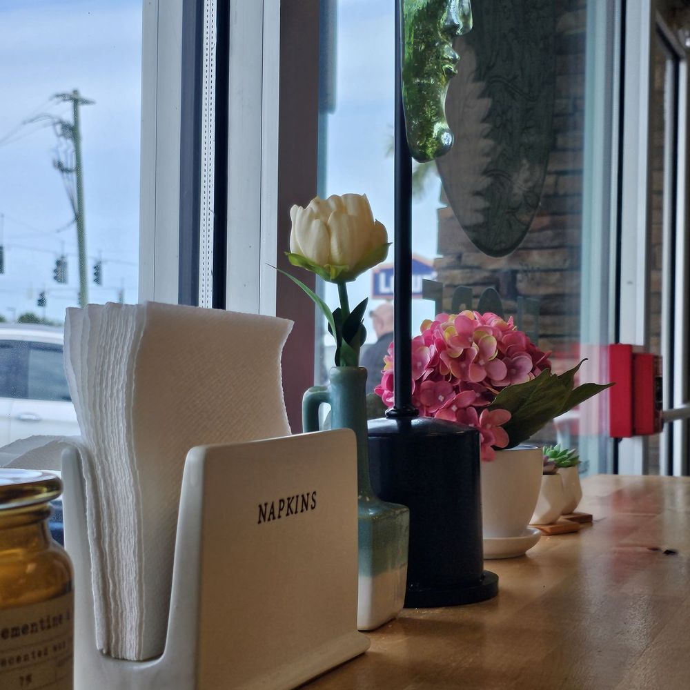 Cafe Flore - Store front table. - Breakfast & Brunch Near Me - Fort Myers, Florida Cafe Flore - Store front table. - Breakfast & Brunch Near Me - Fort Myers, Florida