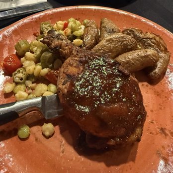 Charr'd Bourbon Kitchen & Lounge - Smoked Berkshire Pork Chop* - Lounges Near Me - Louisville, Kentucky