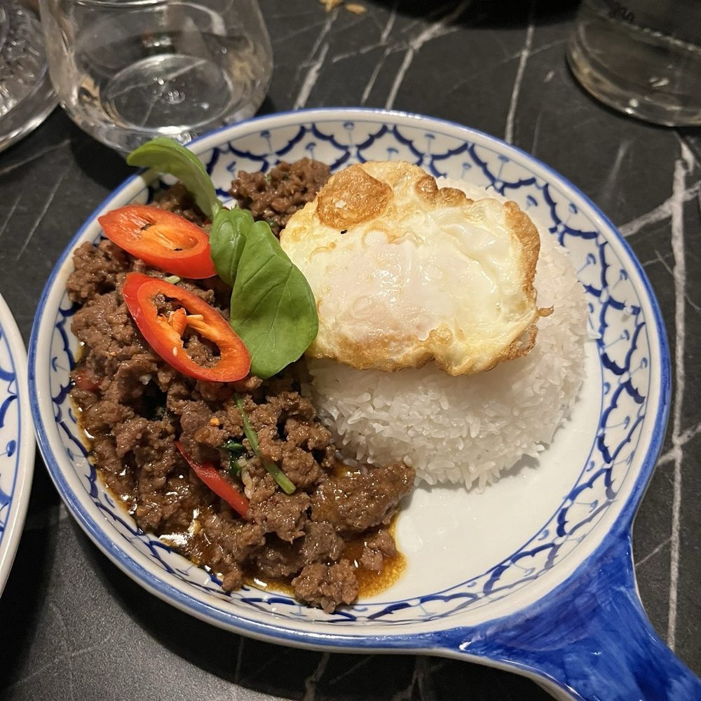 Thai Garden Restaurant - The Comfort dish with over easy egg and spicy Leon grass seasoned beef over rice. - Thai Near Me - Galway, G Thai Garden Restaurant - The Comfort dish with over easy egg and spicy Leon grass seasoned beef over rice. - Thai Near Me - Galway, G