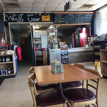Wholly Cow - View of the order window and kitchen from the seating area. - Burgers Near Me - Austin, Texas Wholly Cow - View of the order window and kitchen from the seating area. - Burgers Near Me - Austin, Texas