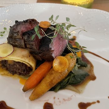 1921 Mount Dora - Duo of American Wagyu Beef with pepper- crusted New York strip, braised short rib crepe, wilted spinach and multi colored carrots - Cocktail Bars Near Me - Mount Dora, Florida