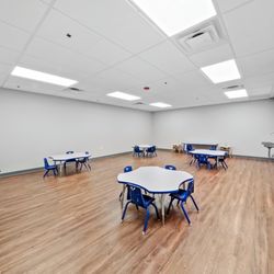 Blue Bird Day - Lunchroom with tables and chairs sized for children.