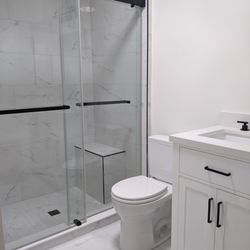 Shower walls, shower floor, bathroom floor tiles and matching grout from Floor & Decor