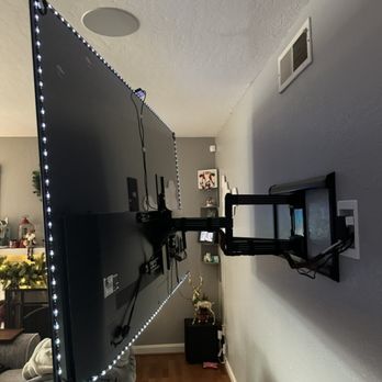 Fertech A/V & Security Solutions - 77" OLED LG with LED strip lights and wired management through the wall - Security Systems Near Me Fertech A/V & Security Solutions - 77" OLED LG with LED strip lights and wired management through the wall - Security Systems Near Me