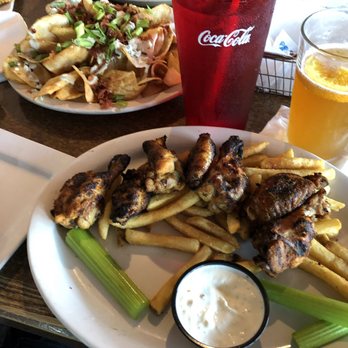 The Brass Rail - Smoked wings over fries with blue cheese chips - American Near Me - O'Fallon, Missouri The Brass Rail - Smoked wings over fries with blue cheese chips - American Near Me - O'Fallon, Missouri