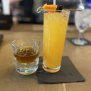 Hovito Ultra Lounge - a glass of orange juice and a glass of whiskey - Lounges Near Me - Indianapolis, Indiana