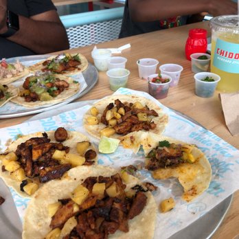 Chido Taco Mercado Style Taqueria - Table loaded with food for about $10 per person. - Tacos Near Me - Raleigh, North Carolina