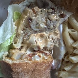 a plate of pasta and a sandwich
