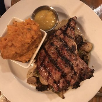 Farm Table - Pork chop with mashed sweet potatos on bed of brussel sprouts - New American Near Me - Wake Forest, North Carolina Farm Table - Pork chop with mashed sweet potatos on bed of brussel sprouts - New American Near Me - Wake Forest, North Carolina