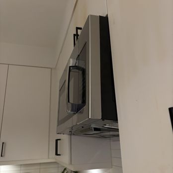 Lyle Apartments - Crooked installation of new microwave after old one shorted out. - Apartments Near Me - Dallas, Texas Lyle Apartments - Crooked installation of new microwave after old one shorted out. - Apartments Near Me - Dallas, Texas